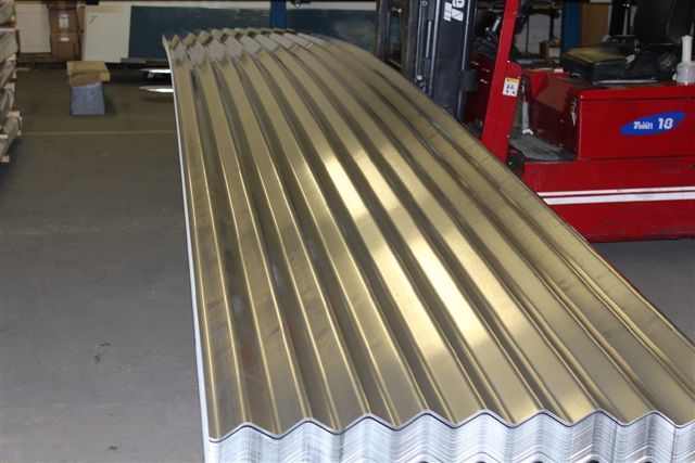 A stack of 4.2 corrugated metal panels cut at a length of 28 ft. 6 inches