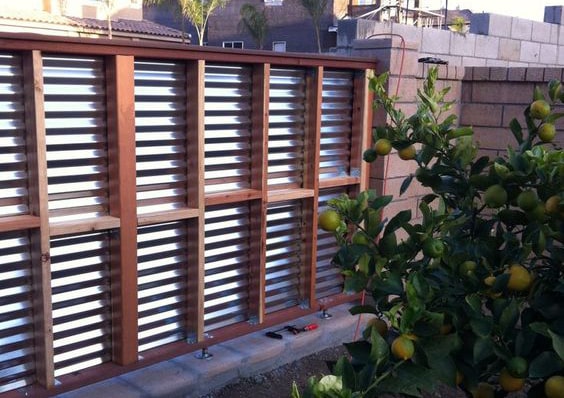 Corrugated metal panel fence